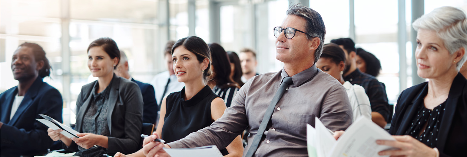 A group of business professionals attending a lecture