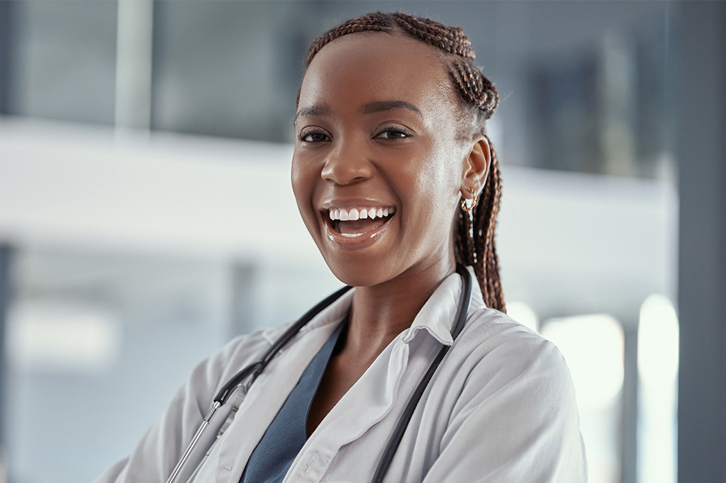 A smiling doctor in white lab coat