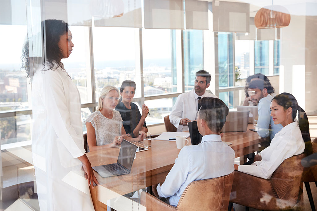 A doctor gives a presentation in a conference room